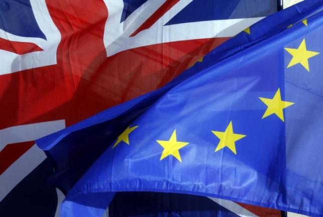 A British Union Jack flag and an European flag fly on the Amiens city hall during a a Franco-Britain summit in Amiens