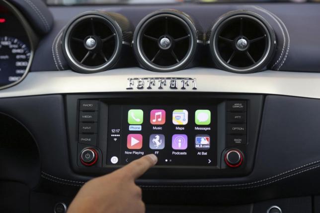 File photo of Apple's Stephen Chick displaying the CarPlay program at the Worldwide Developers Conference in San Francisco