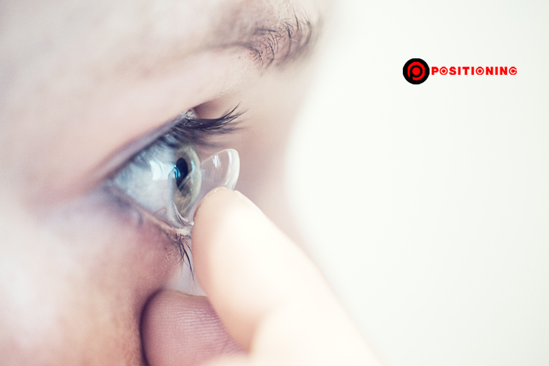 Close up of woman putting in contact lens