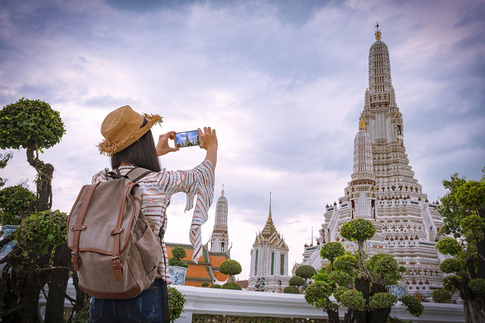 Asian woman tourists are taking photos With a smartphone at the