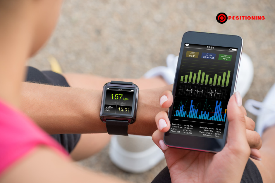 Running Female With Mobile Phone Connected To A Smart Watch