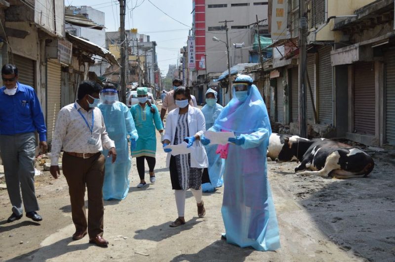 Indian-medics-team-visit-a-COVID-19-hotspot-area-that-has-been-sealed-during-lockdown-to-prevent-the-spread-of-the-viru