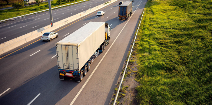 Top view of White Truck motion blur on highway road with contain