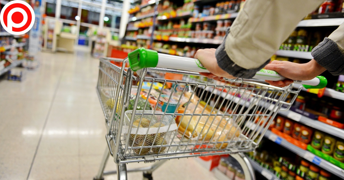 shopping consumer A,Shopper,Pushes,A,Trolley,Along,A,Supermarket,Aisle,-