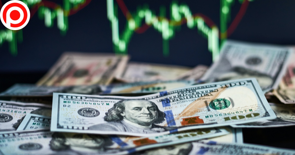 Us,Dollar,Bills,On,Background,With,Dynamics,Of,Exchange,Rates.