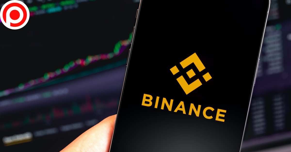 Binance,Logo,Mobile,App,On,Screen,Iphone,And,Macbook,Closeup.