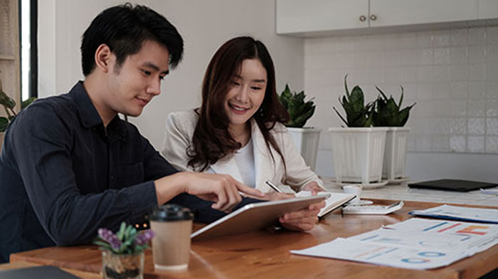 Business team presentation meeting asian man finance executive discusses meetings to plan work, investment projects, and trading strategy for trading partners