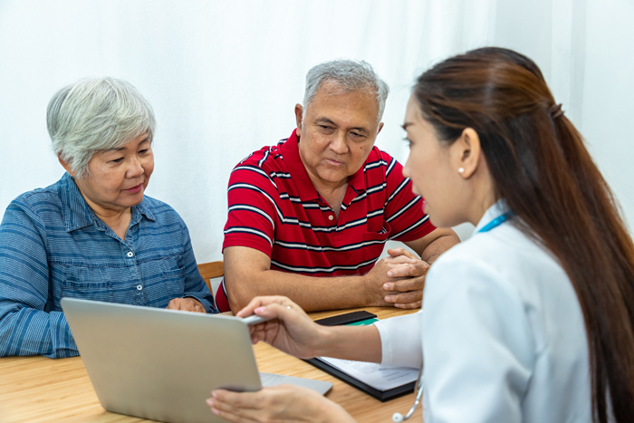 Medical doctor explaining unhappy result to senior elder patient