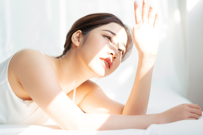 Portrait of young asian girl under the sun