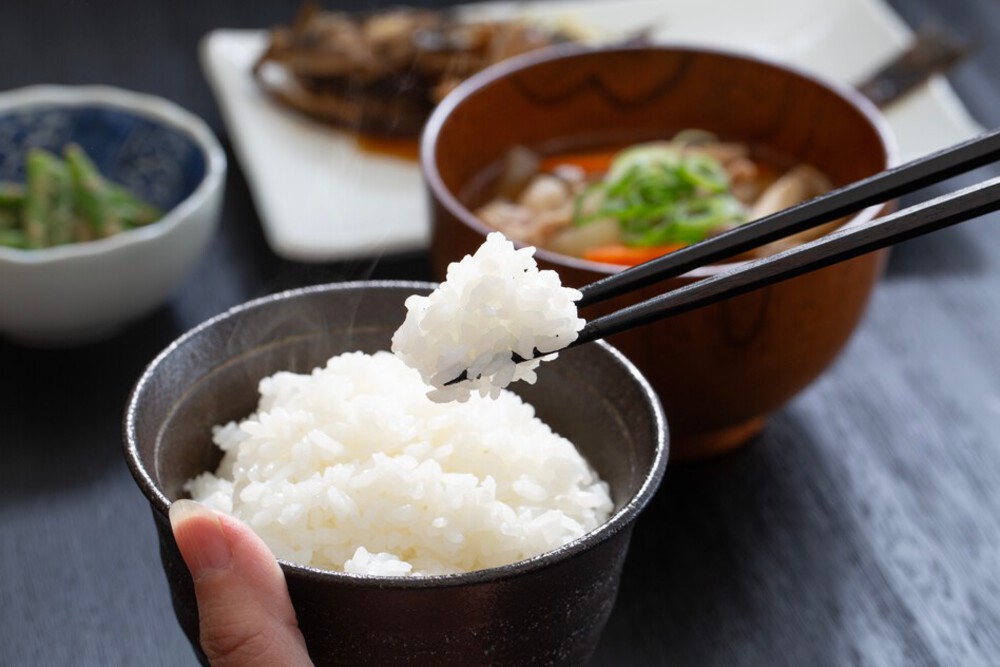 Hand,Of,A,Japanese,Woman,Eating,Dinner