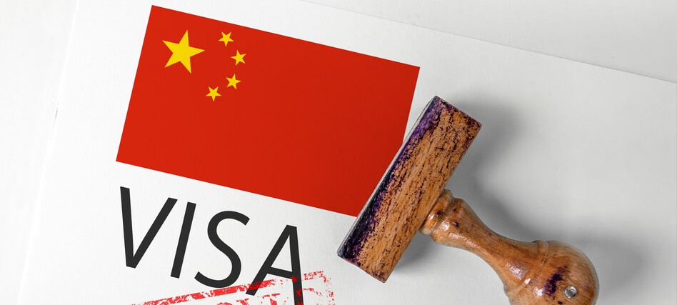 China,Visa,Approved,With,Rubber,Stamp,And,Flag