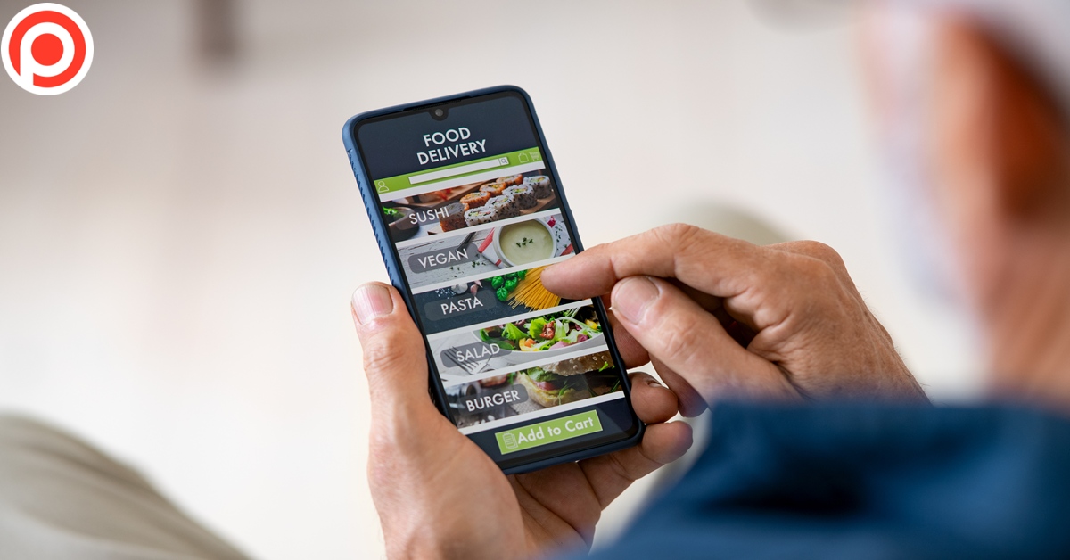 Top,View,Of,Man,Hands,Holding,Smartphone,While,Order,Food